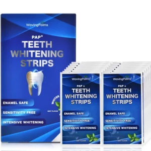 Close-up of Waving Palms teeth whitening strips demonstrating their easy application for a brighter smile with reduced sensitivity.
