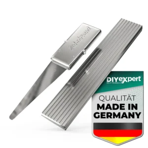 A 12-pack of flat, platinum-colored Zahnfreund dental cleaners with silver leaf detail, each in a metal case designed for easy portability in pockets or handbags.